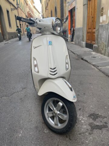 White scooter in an alleyway
